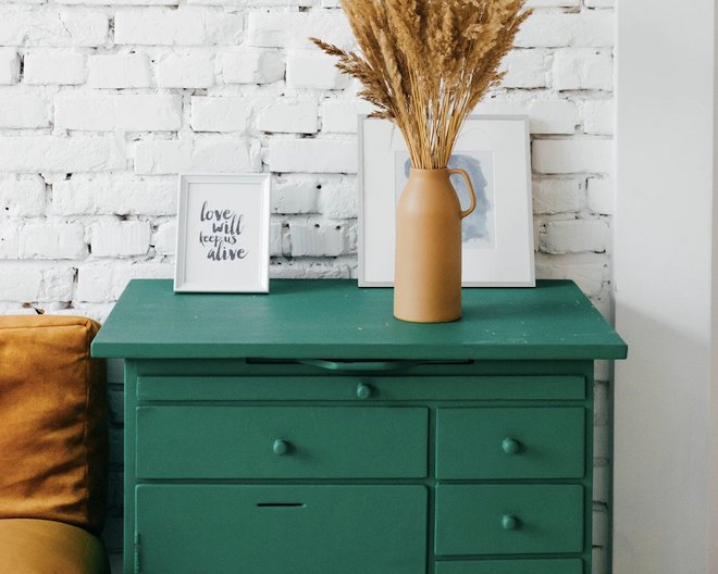 A green drawer with a vase